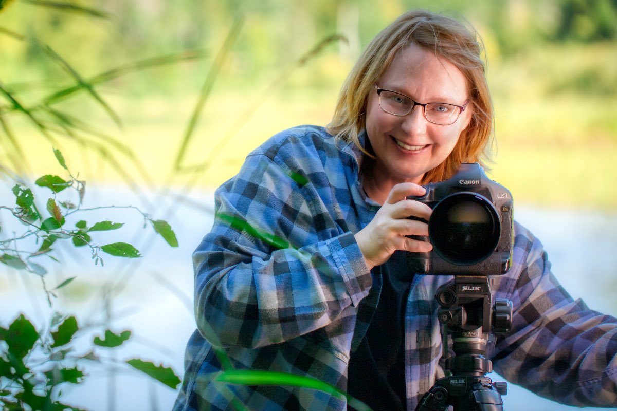 Photographer posing with the Canon 1Ds Mark III classic DSLR camera.