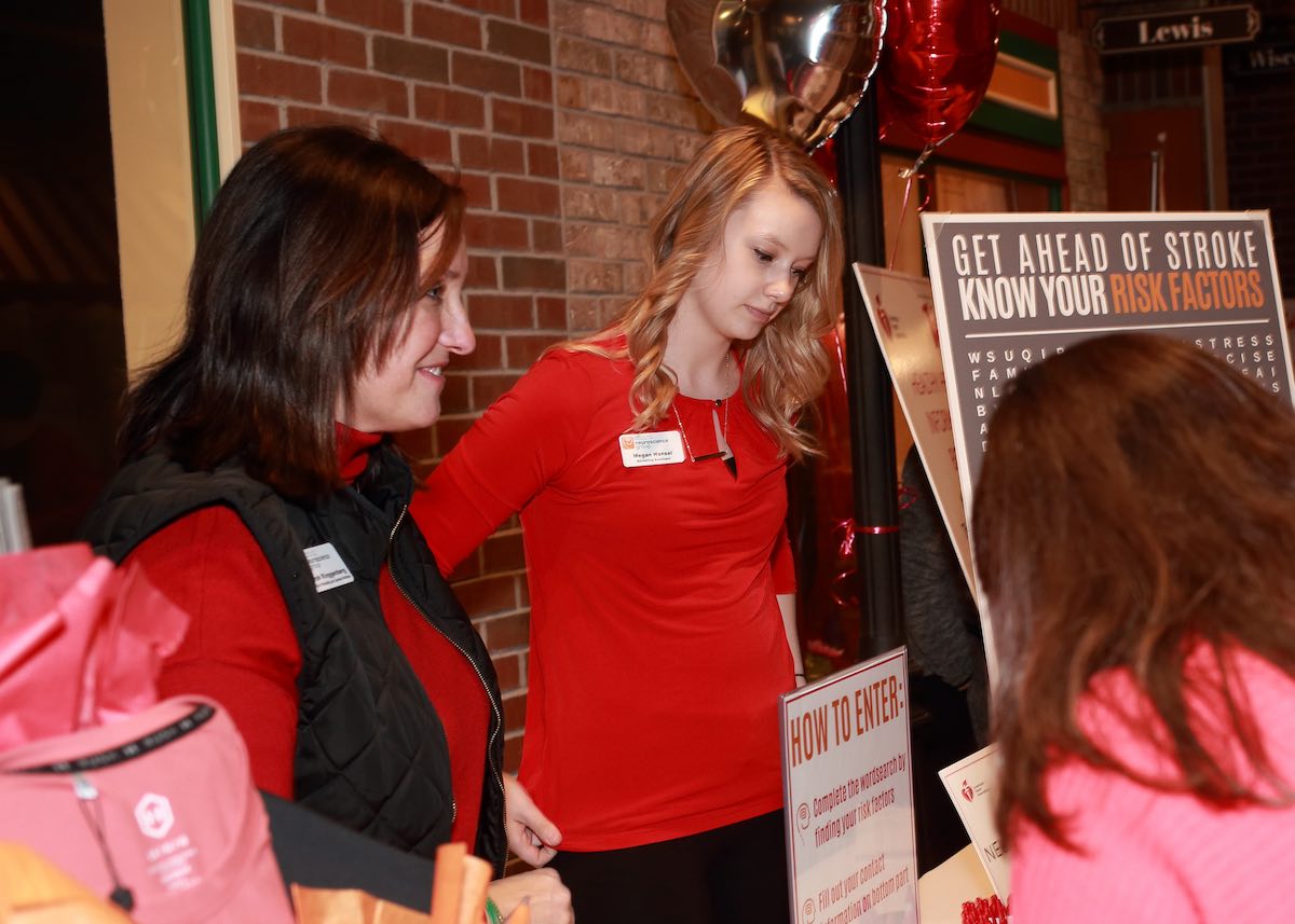 Go Red Fox Cities volunteers help guests for the American Heart Association